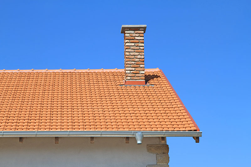 Stock Image - chimney on home -Central Masonry & Chimney Chimney on Home