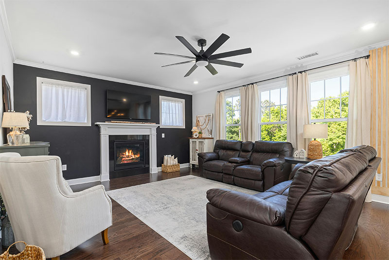 Stock Image - fireplace -Central Masonry & Chimney living room with a lit fireplace