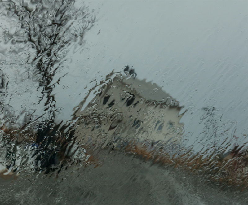 Stock Image - house in the rain -Central Masonry & Chimney house in the rain