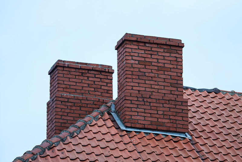 2 red brick chimneys